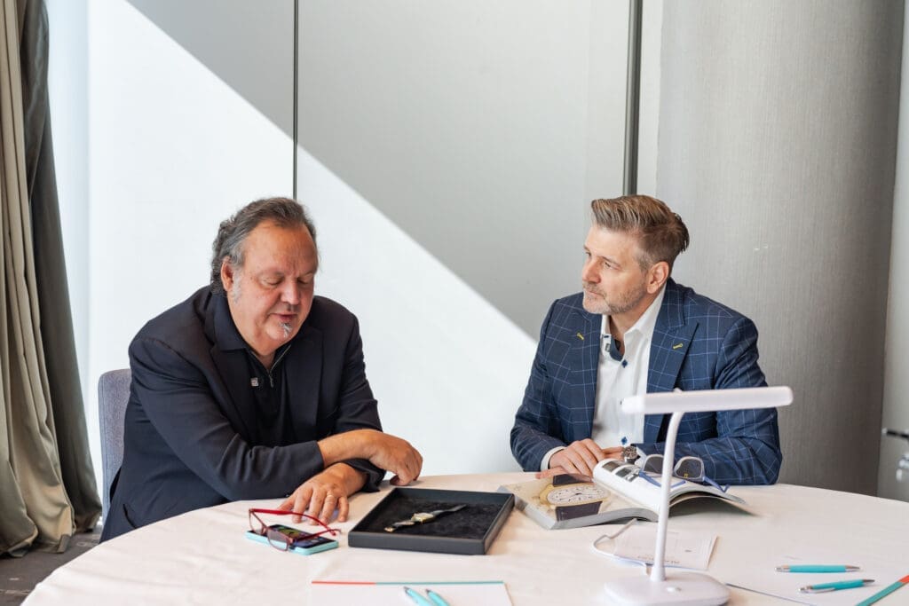Monaco Legend Group chairman Davide Parmegiani with Houstonian Rob Chramosta and the Sir Henry Segrave Patek Philippe watch.(Courtesy photo)