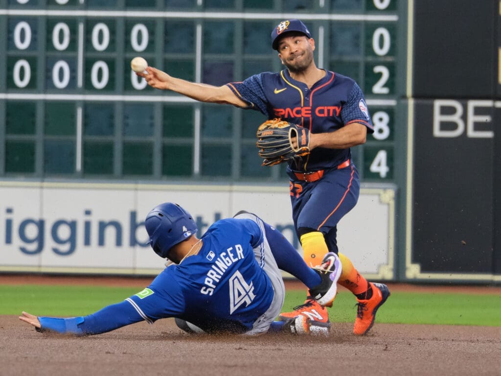 Houston Astros second baseman Jose Altuve and old buddy George Springer are used to meeting by now. (Photo by F. Carter Smith)