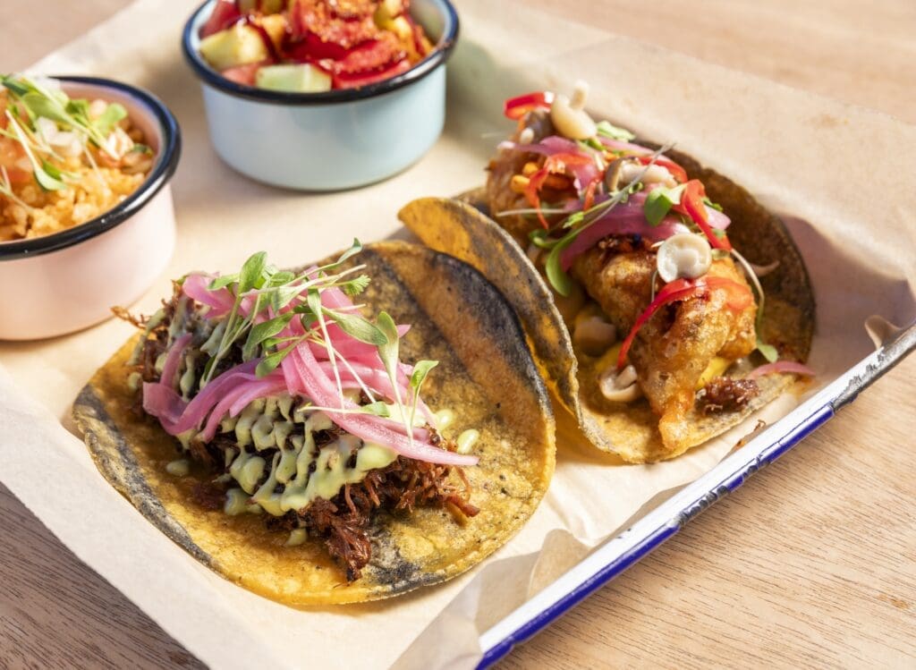 Maximo's Barbacoa and tempura fried Mushroom Tacos with rice and fruit sides are stand outs. (Photo by Julie Soefer)