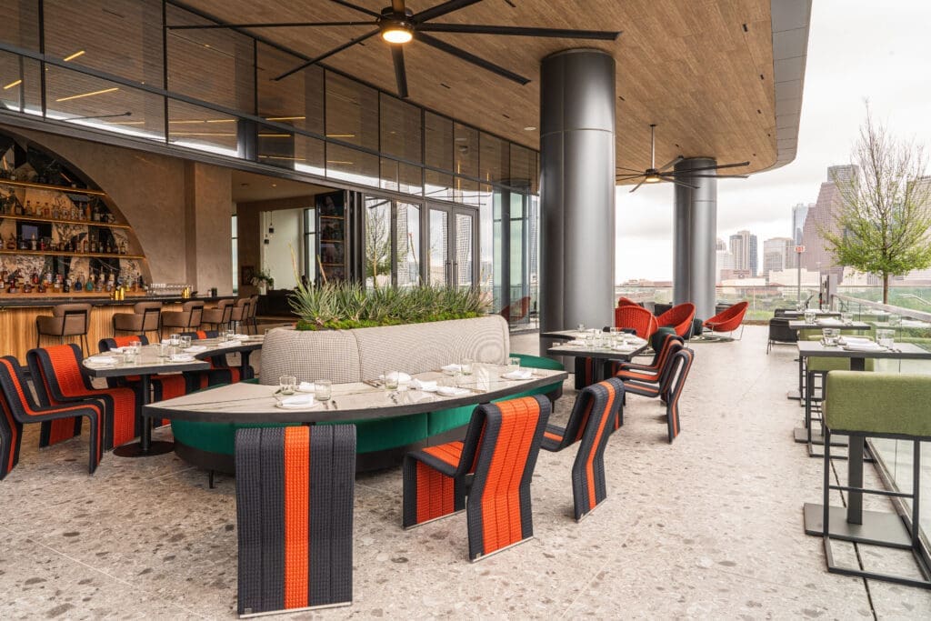 Relax after spa treatments in the Thompson Houston hotel patio dining area.