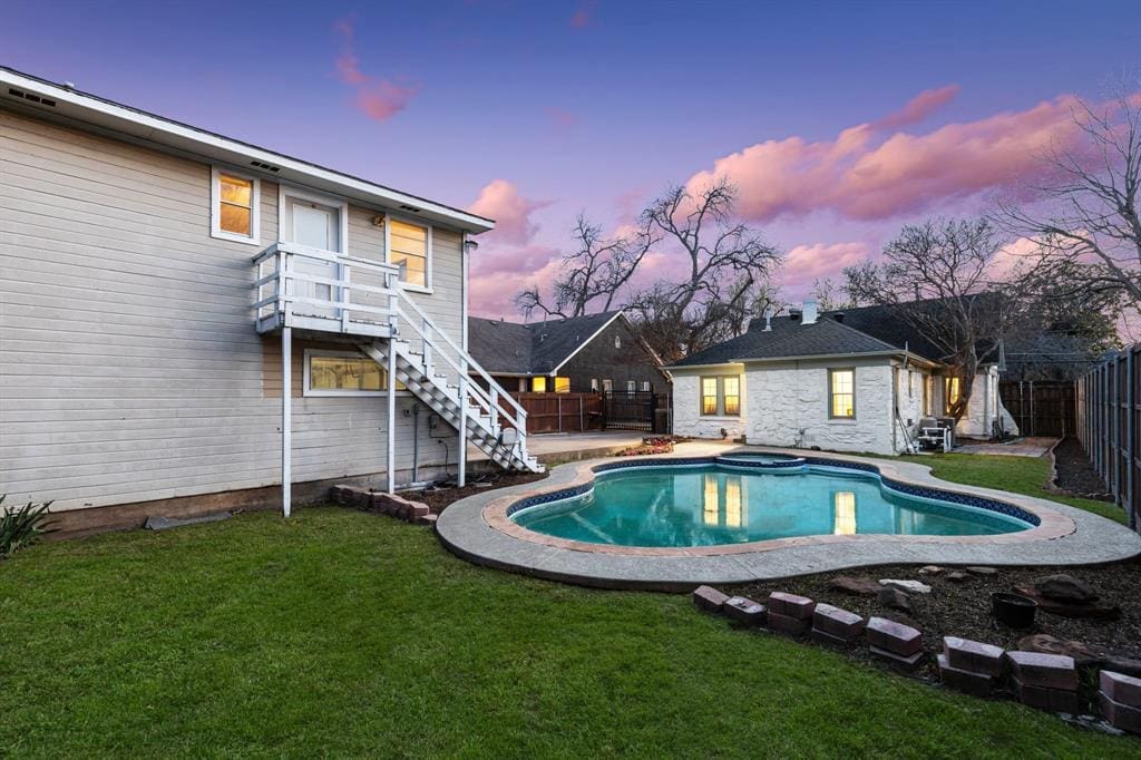 Out back, a manicured backyard pool is perfect for hosting and a quaint mother-in-law suite can be used for a studio or a bit of extra income. 