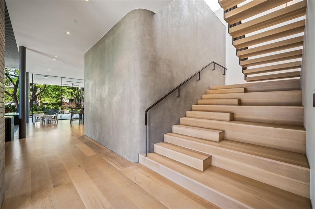 A unique, minimal stairwell sets the tone. 