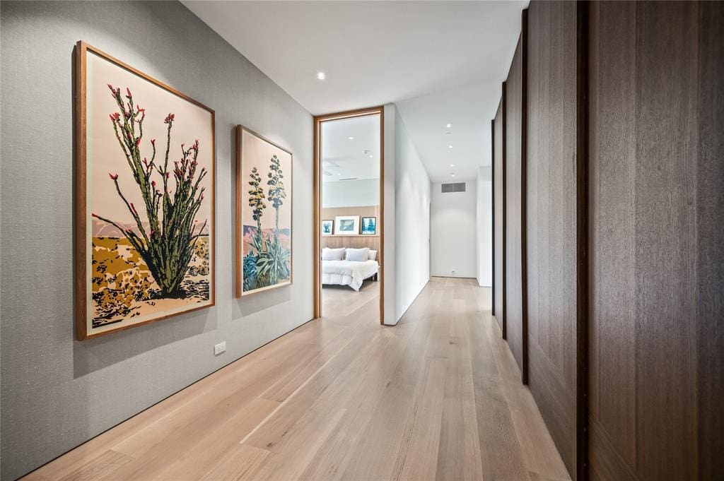 Natural light seeps into a windowless hallway. 