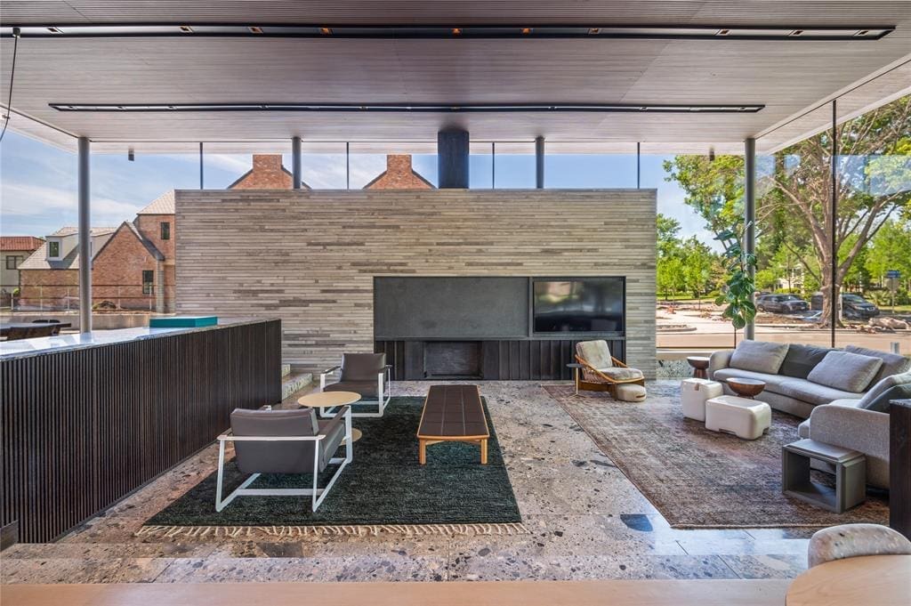 The living area feels intimate in the sprawling, glass-lined space.
