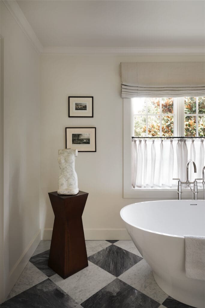 In the main bath, Eugene Gauss 1974 marble sculpture on industrial metal pedestal from 1stdibs. Alissa soaker tub. (Photo by Trevor Parker)