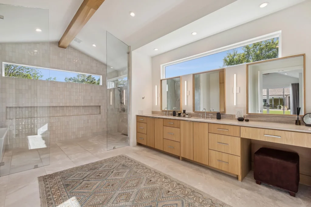 Step into the primary bath with its wet room and clerestory windows.