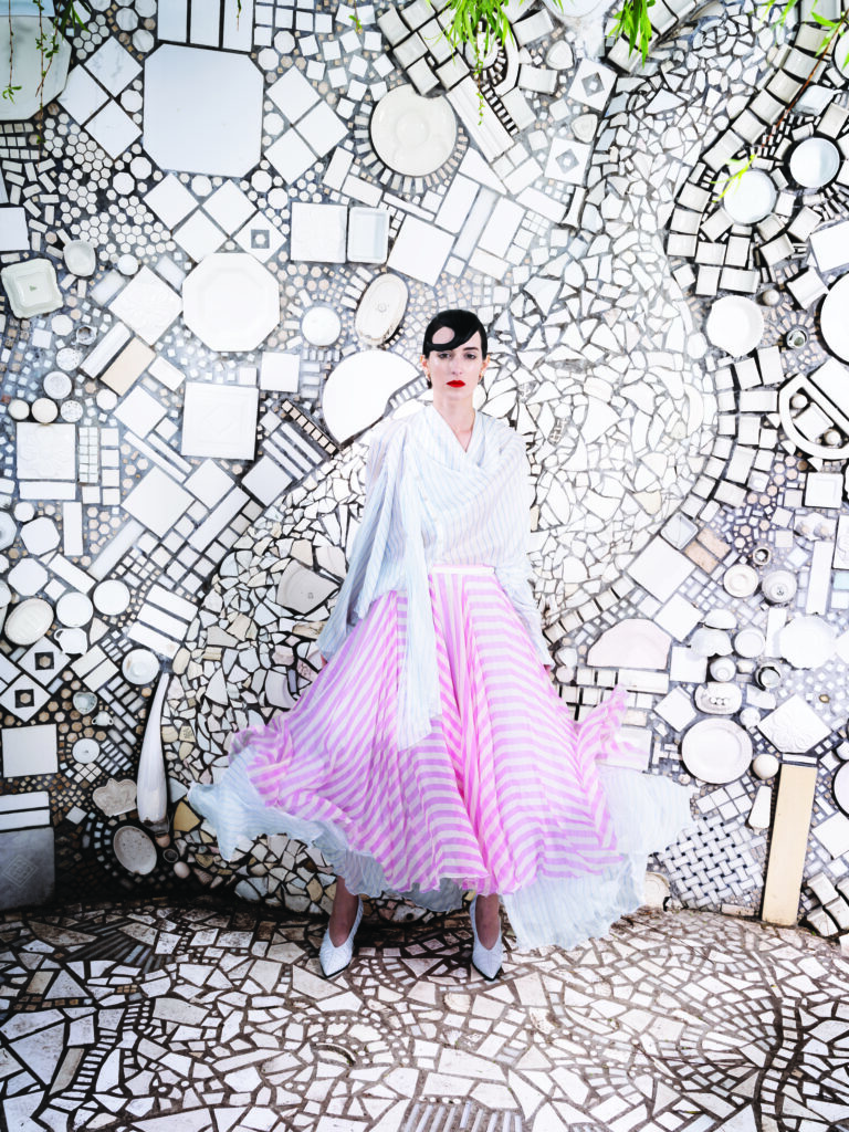 Louis Vuitton double-stripe draped blouse $3,650, mixed-stripe tiered skirt $6,200, and LV Knot pump $1,360. 