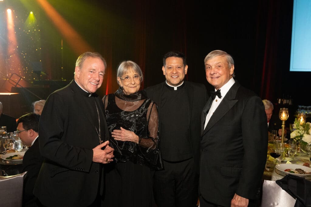 Archbishop J. Michael Miller, Annie Graham, the Rev. Dempsey Rosales-Acosta, Bob Graham at the University of St. Thomas gala (Photo by Gwen Juarez)