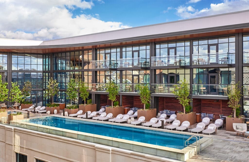 The private Bowie House terrace features a heated pool, a hot tub, private cabanas, and a bar.