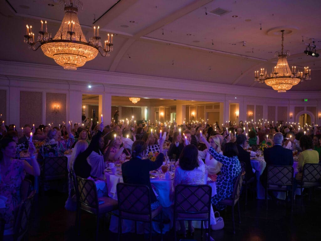 The candle lighting ceremony at CanCare's 30th annual Hope Survivorship luncheon touched on many emotions. (Photo by Daniel Ortiz)