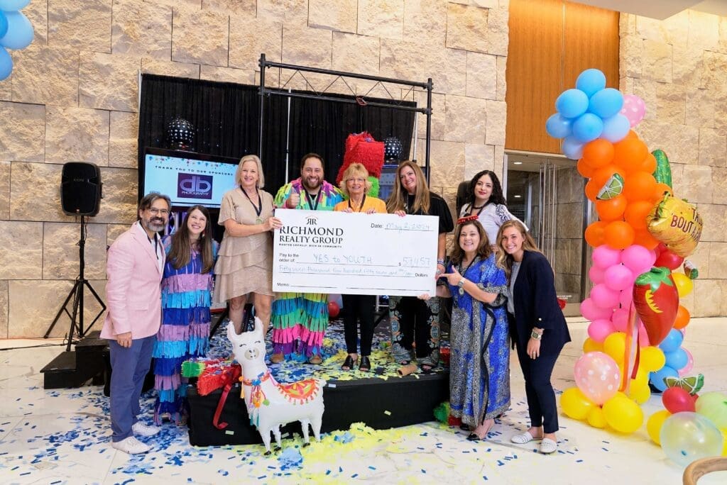 Juan Carlos Martinez, Rachel Richmond, Marlys Mulkey, Zach Richmond, Vicki Richmond, Michele Kooken, Theresa Wagaman, Ruby Rojas and Aleisha Zapata support Yes to Youth. (Photo by Derrick Bryant Photography)