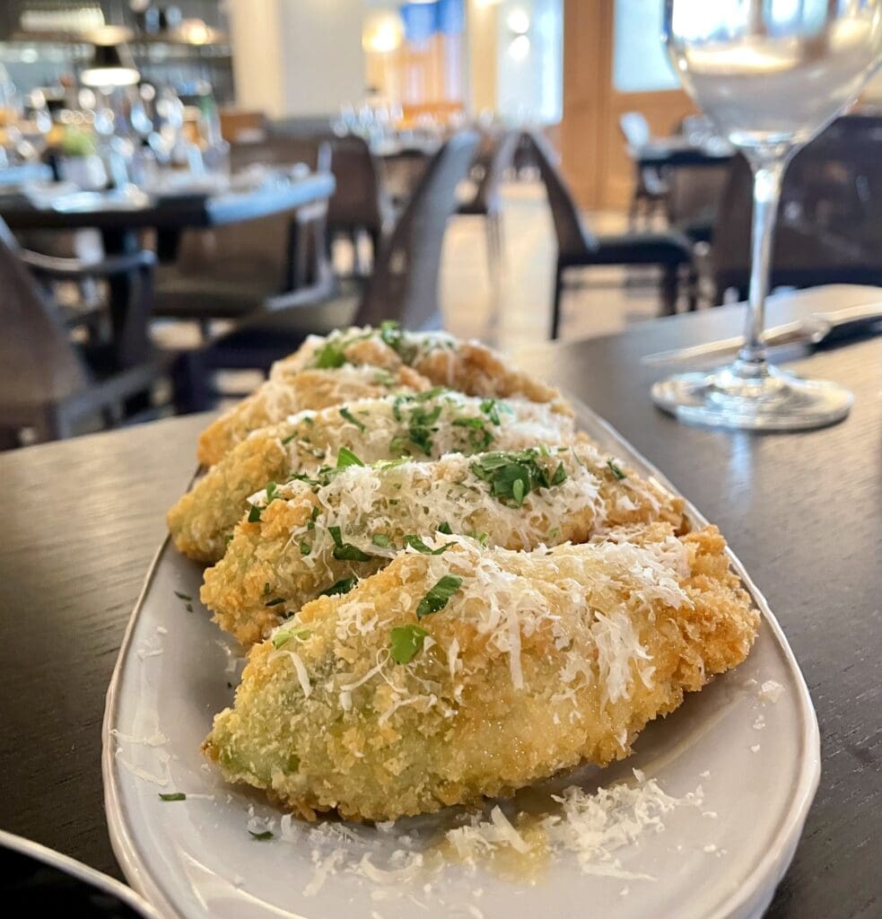Squash blossoms filled with goat cheese, and served with local honey and sea salt. (Photo by Courtney Dabney)