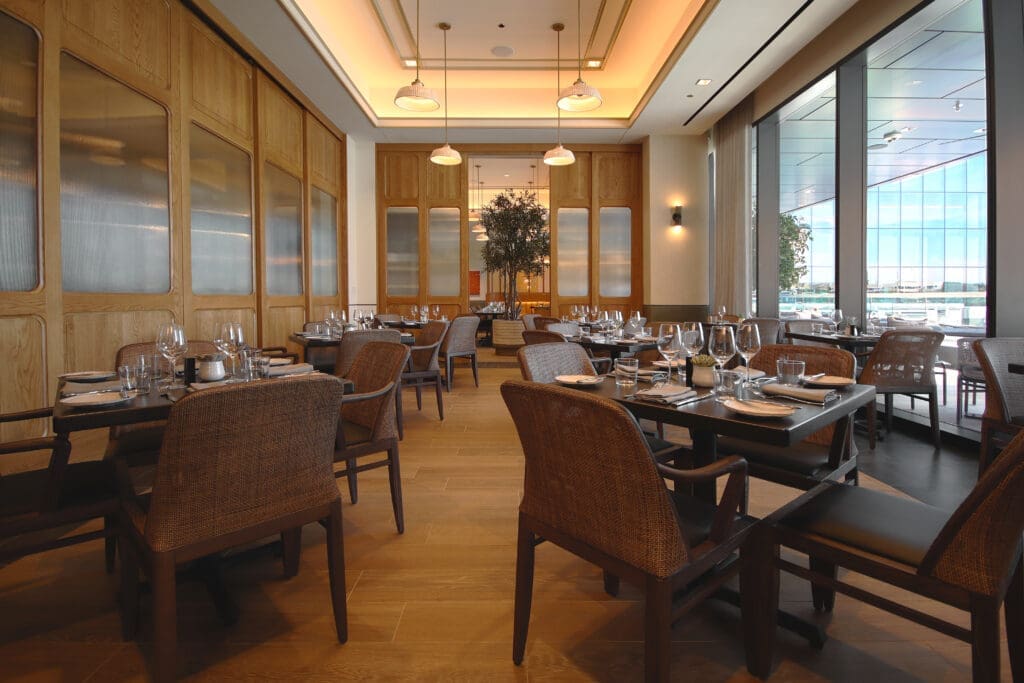 Step inside the private dining room at Farena, with sunset views beyond the pool amenity. (Courtesy Loews Hotel)