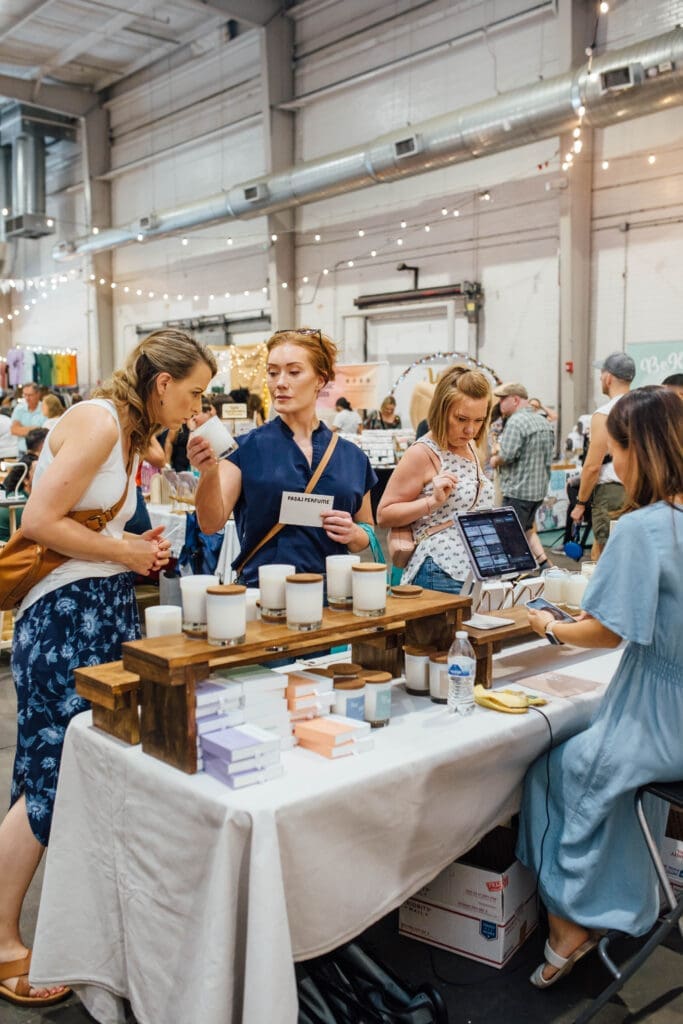 Customers looking at candles at a Markets for Makers event (Photo by Cole LoCurto)