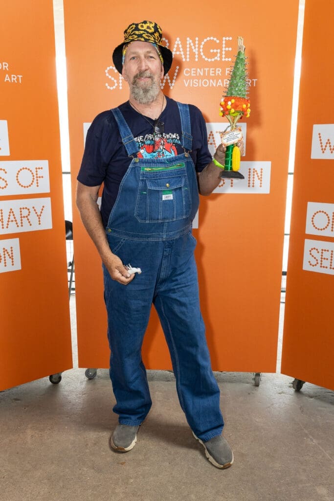 Joe Haden wins award for "Sunflower"  at the Orange Show's Art Car Award Ceremony. (Photo by Emily Jaschke) 