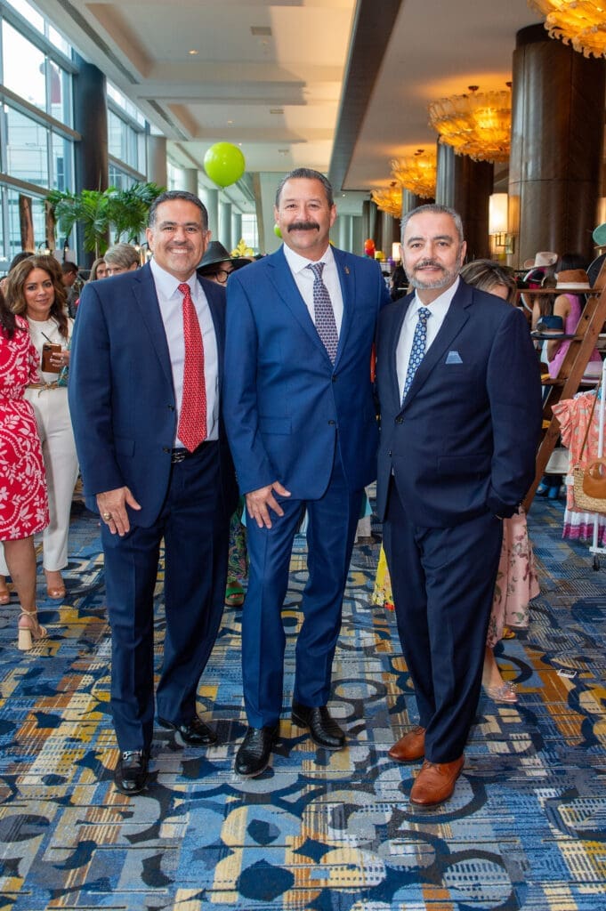 Juan Garcia, Thomas Lewis, Joaquin Jimenez at the Latin Women's Initiative fashion show and luncheon. (Photo by Jacob Power)
