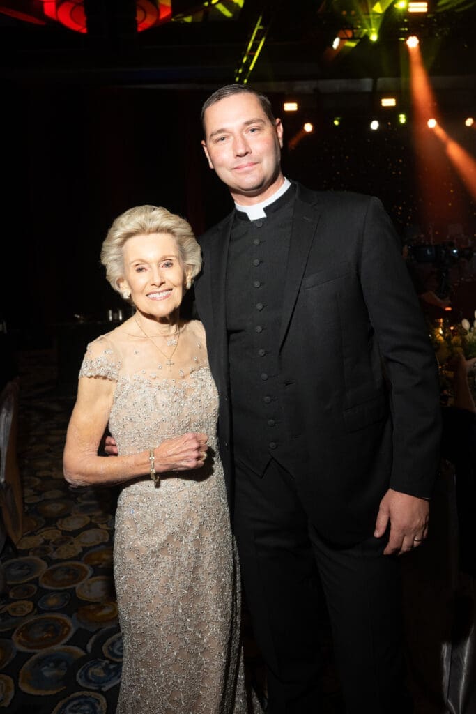 Lois Davis, Father Charles Hough at the University of St. Thomas gala (Photo by Gwen Juarez)