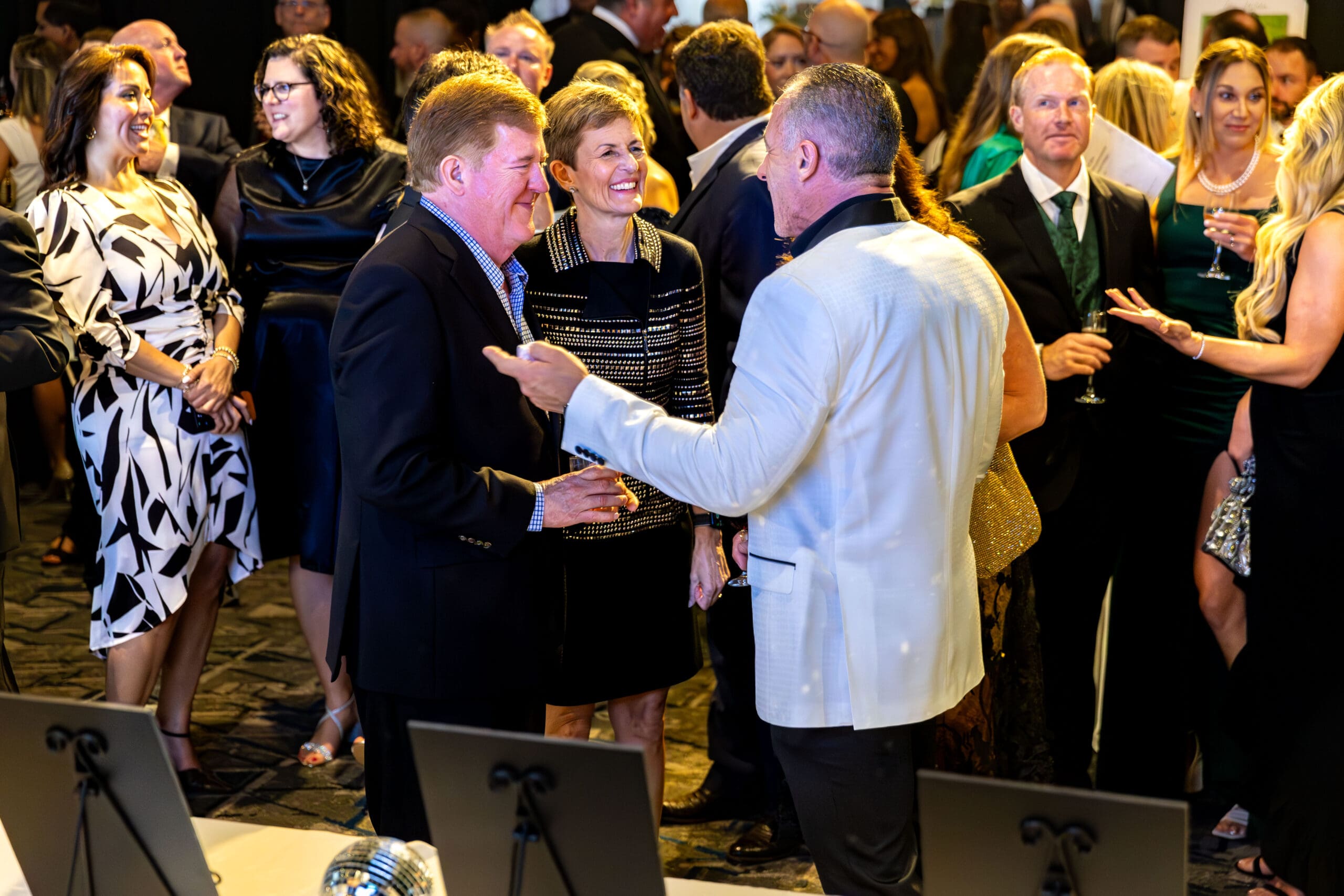 TWCA’s head of school Julie Ambler and Price Ambler mingle with Anthony George, chief governance officer of the school's Governance Board.