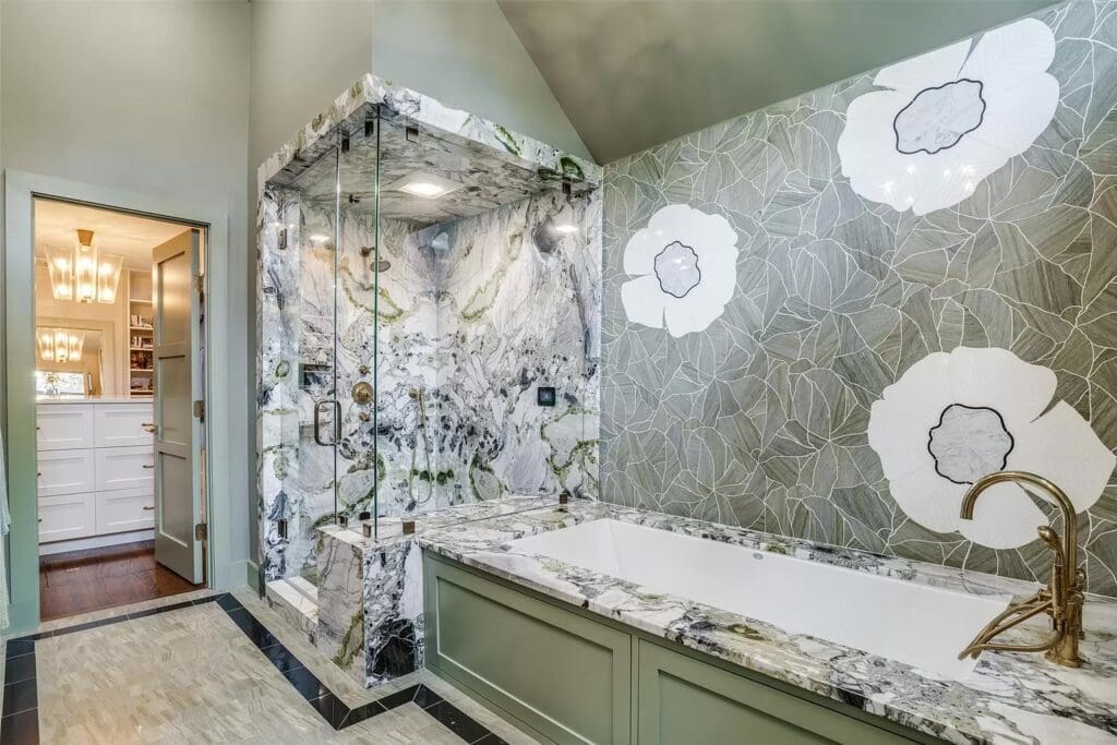 Unique stonework in the primary bathroom, which features a bidet and a linen closet.