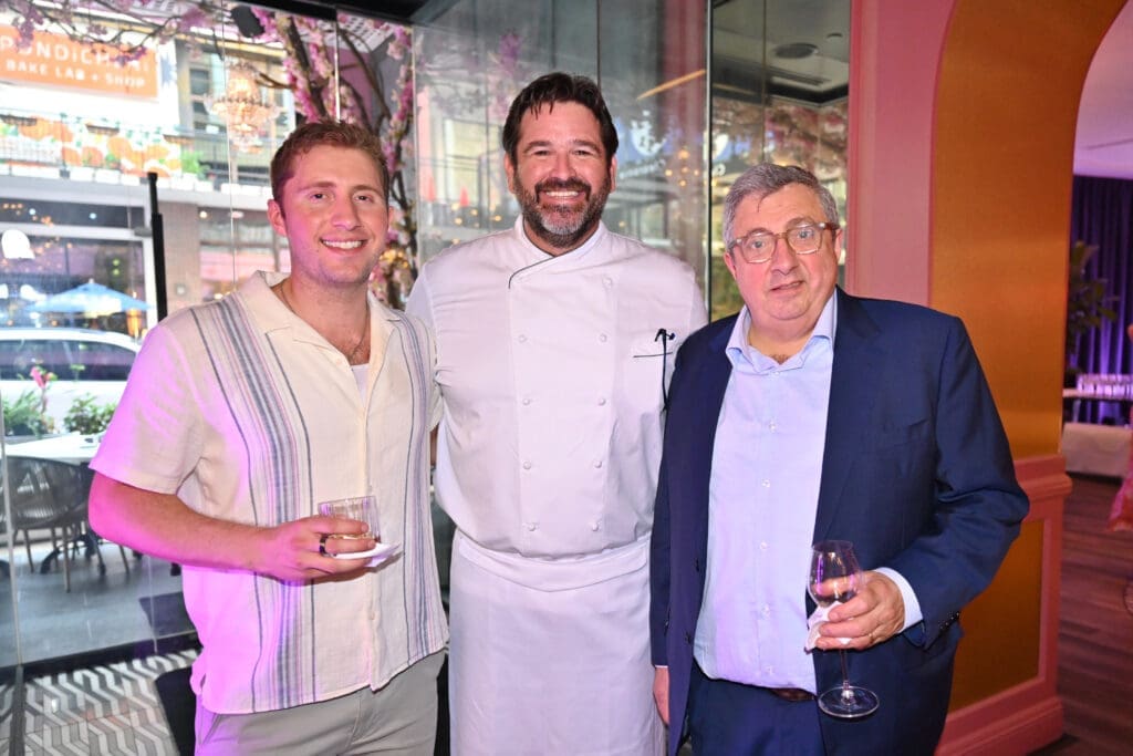 Harry Massoud, Elie Massoud, and Chef Bryan Caswell at the American Cancer Society 'Men Wear Pink' event at PostScript (Photo by Alex Montoya)