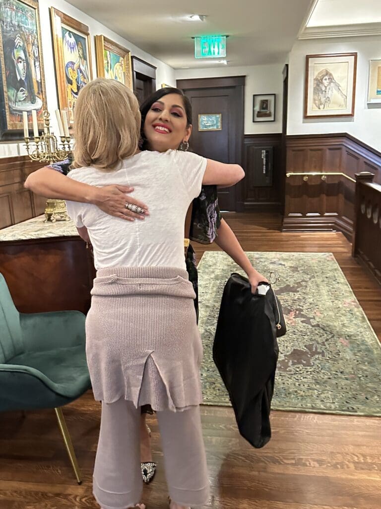 Lyndsey Zorich greets Dr. Sippi Khurana at the PaperCity Philanthropy in Fashion  Best Dressed photo shoot at La Colombe d'Or. (Photo by Shelby Hodge)