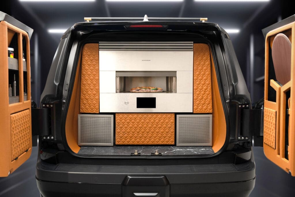 The Lexus Monogram GX features a Monogram 30-inch smart flush hearth oven, plating area, and custom pizza peel storage.