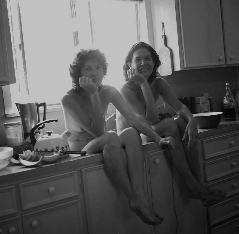 Mary Margaret Hansen's "After Breakfast Photo Shoot," circa 1980s, is a feminist take on the concept of being a housewife. The image is a portrait of the photographer (left) with fellow photographer/collaborator Patsy Cravens. 