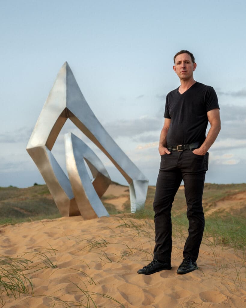 Artist Morgan Robinson (pictured here with his "Nestle" sculpture, has adopted Houston as his art base.