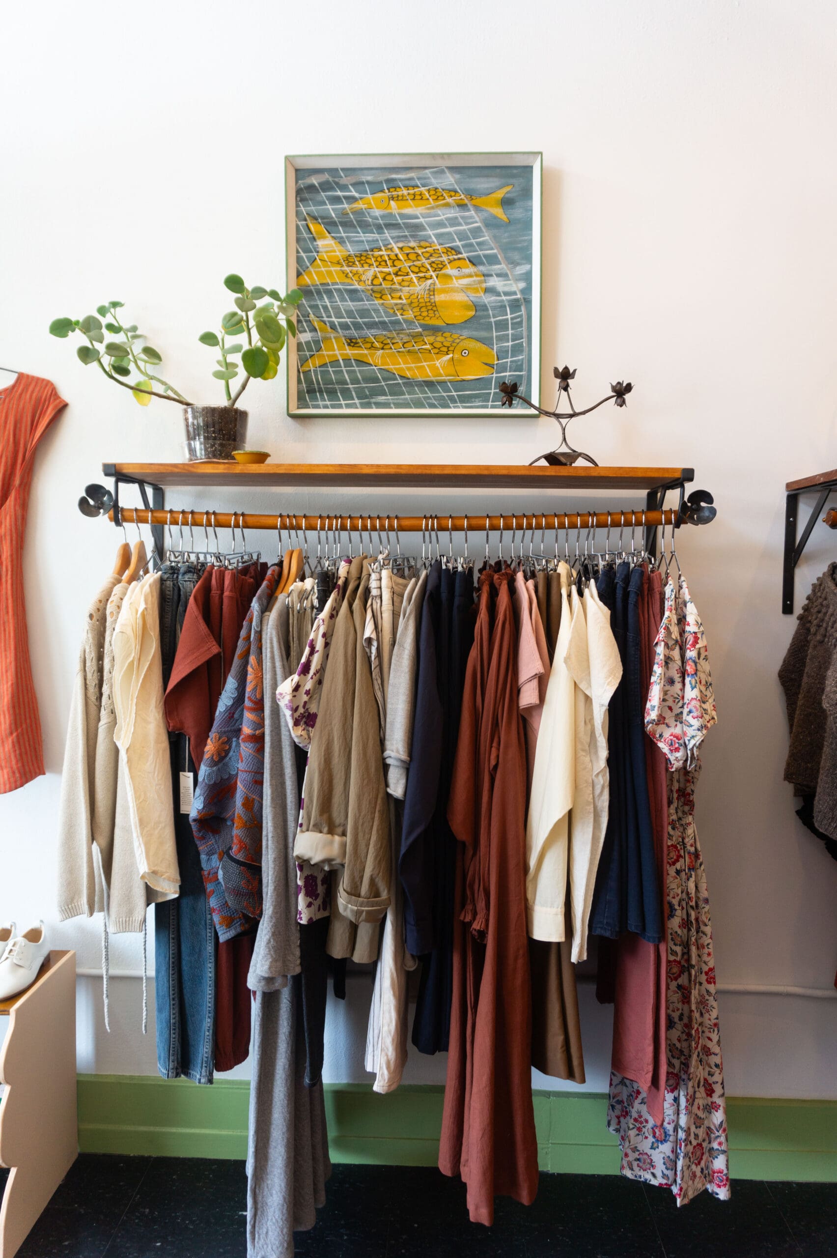 Clothing rack and vintage fish art help set the Ollie Shop vibe. (Photo by Sofia Westerman)