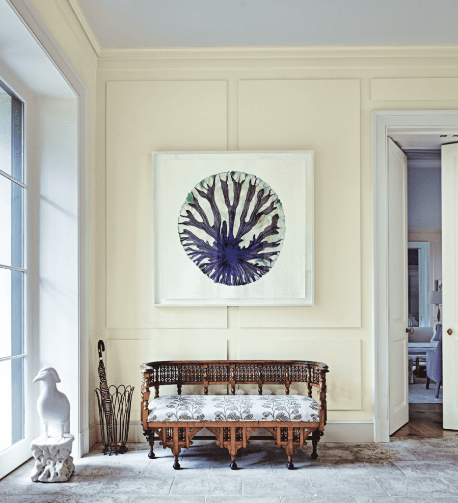 In the entryway, a circa-1900 Anglo-Indian bench from Obsolete, L.A., upholstered in Kerry Joyce fabric from George Cameron Nash. Umbrella stand from Orange, L.A. Marble bird from JED Interior Design and Antiques, East Hampton. Liz Ward painting from Talley Dunn Gallery.  (Photo by Richard Powers)