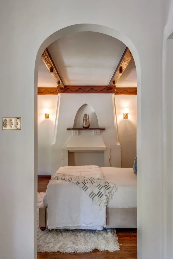 The primary bedroom's Spanish Colonial Revival style fireplace. 
