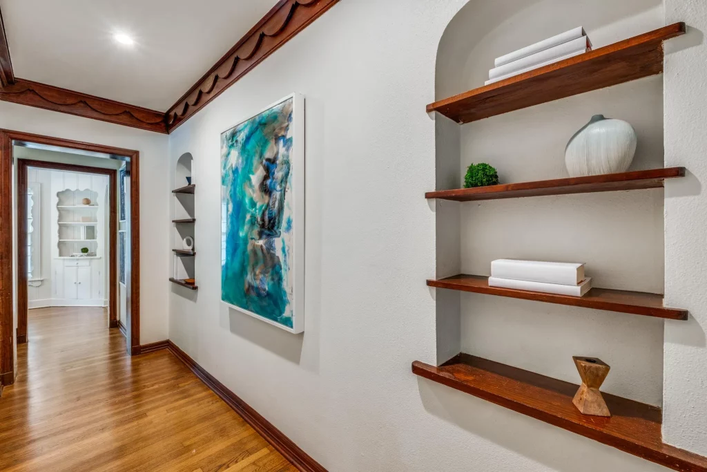 A hallway with gorgeous wood detailing. 