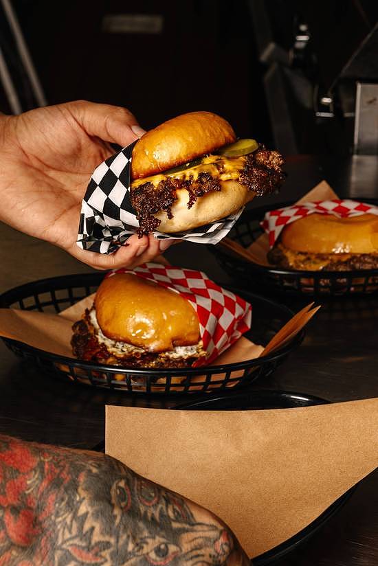 Local Dallas DJ Will Rhoten (aka DJ Sober) opened smash burger spot, Herby's, in Oak Cliff in 2024. (Courtesy of Uber Eats)