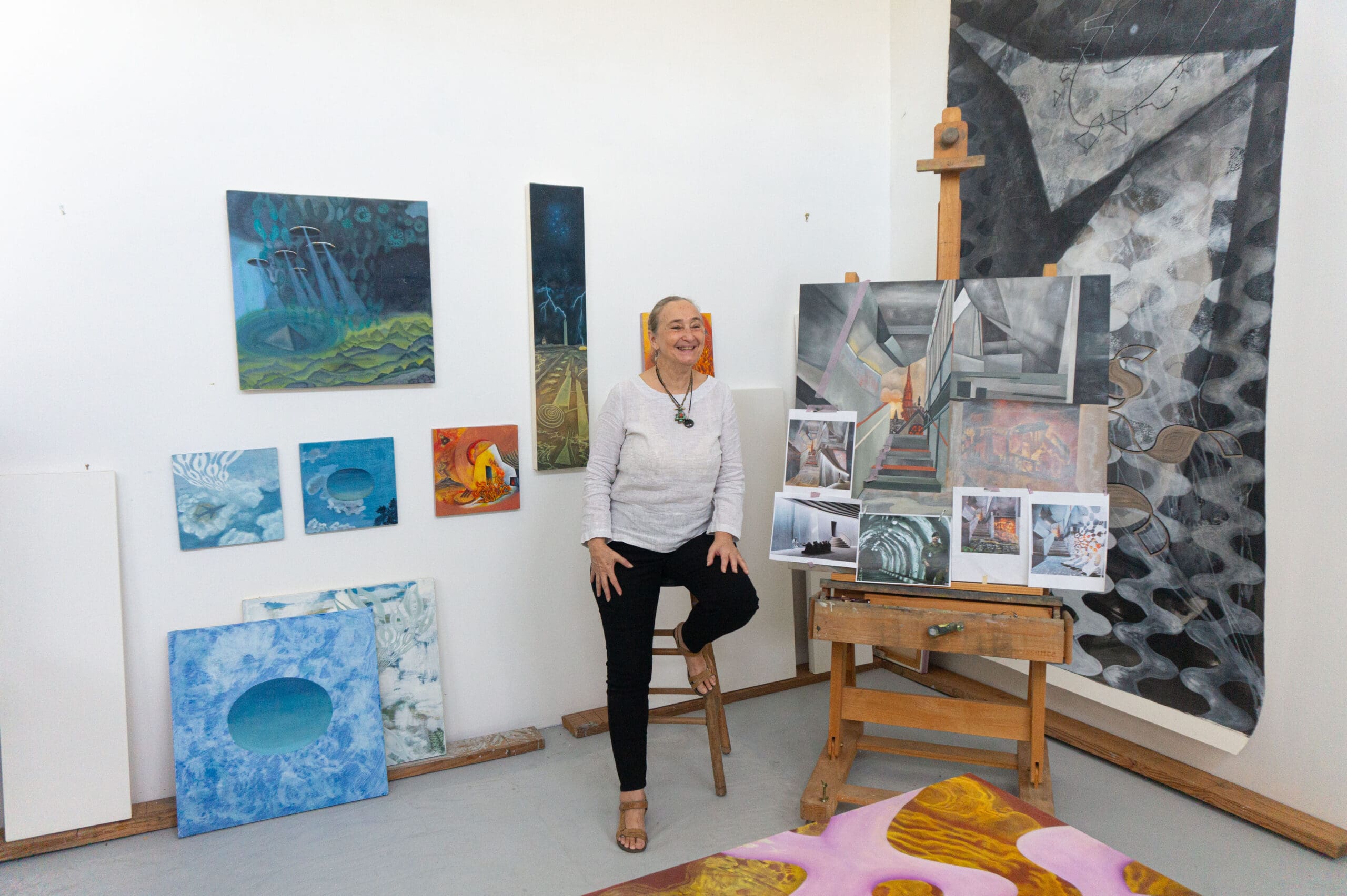Arielle Masson surrounded by her paintings (Photo by Sofia Westerman)