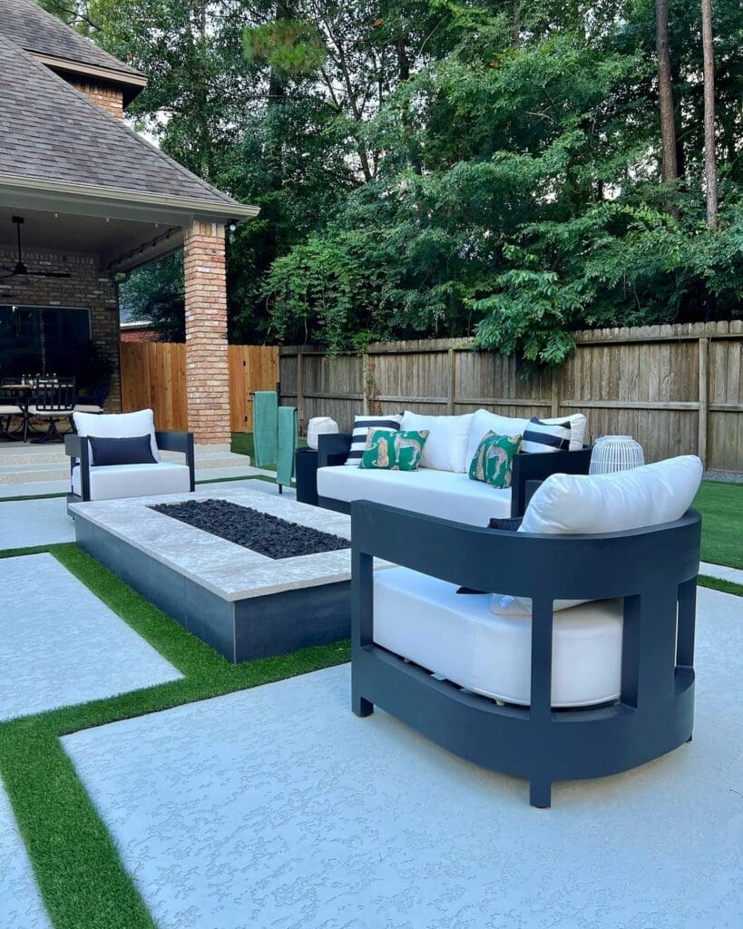 The large firepit area is one of Basso's favorite spots.  Lagasse pulled lush greens into the pillows to balance Basso's love of black and white.