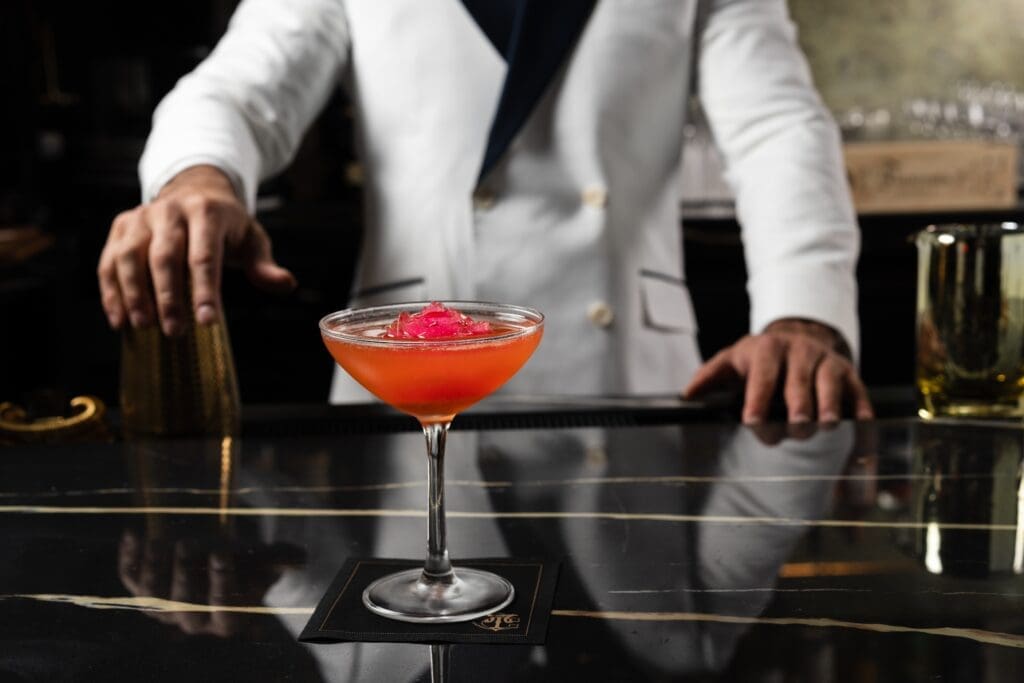 Turner's Cut boasts cocktails like Sophia’s Bubbly Punch, a pink-hued elixir created with Aperol, St-Germain, and brut champagne served in a coupe glass chilled with a rose-shaped ice cube (for 24. (Photo by Brian Kennedy)