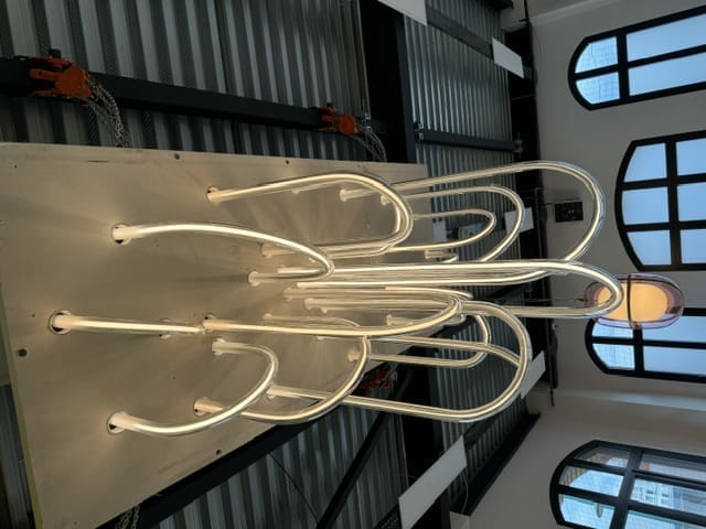 A stunning light fixture chandelier hangs above Mathieu Lehanneur's workspace. (Photo by Donatella Benckenstein)