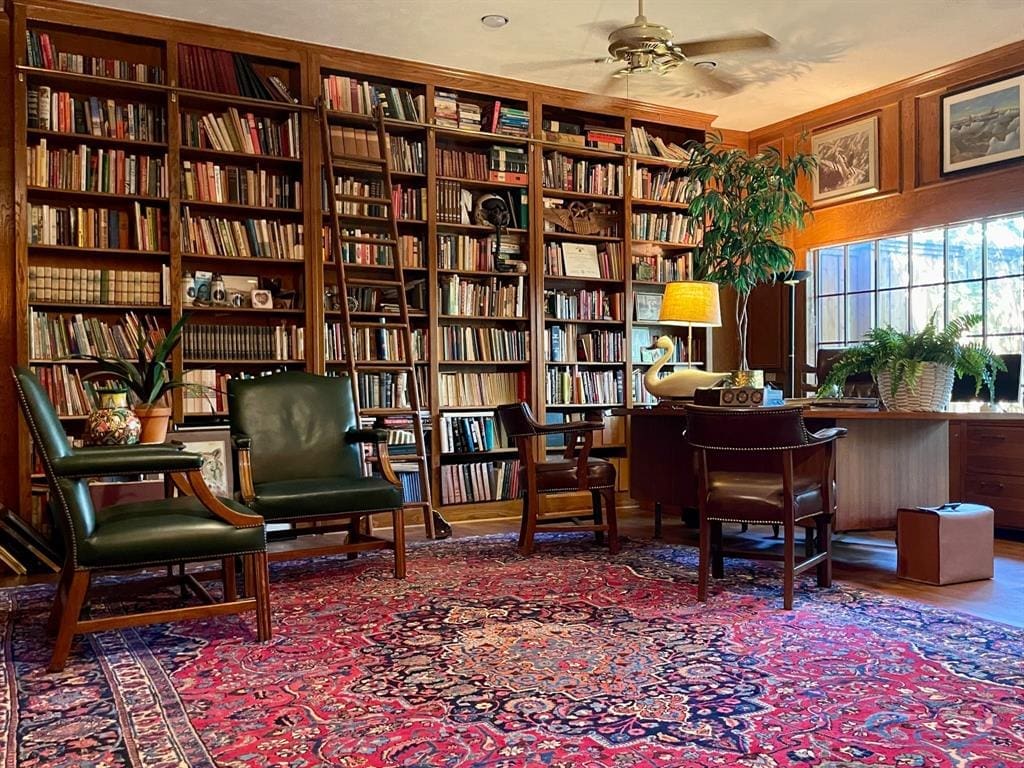 An office and library with floor-to-ceiling bookshelves was added to the home and overlooks the backyard gardens.  (Photo by Douglas Newby & Associates)