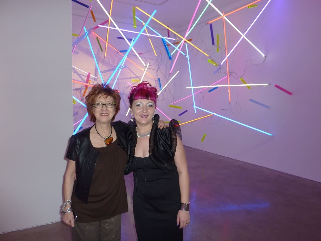 Anya Tish with another discovery, artist Adela Andea, at her illuminated installation at the gallery.