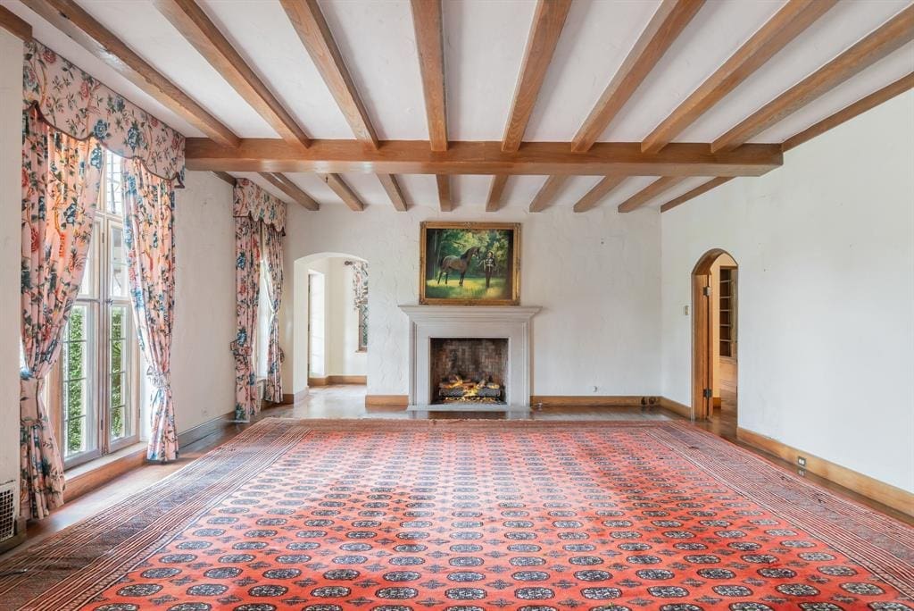 The stunning formal living area features a portrait of former owner Marilyn Hoffman.