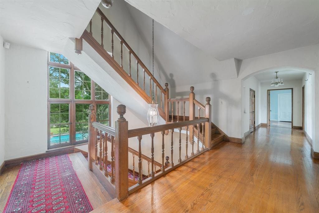 Lofty windows light the way up the stairs. 