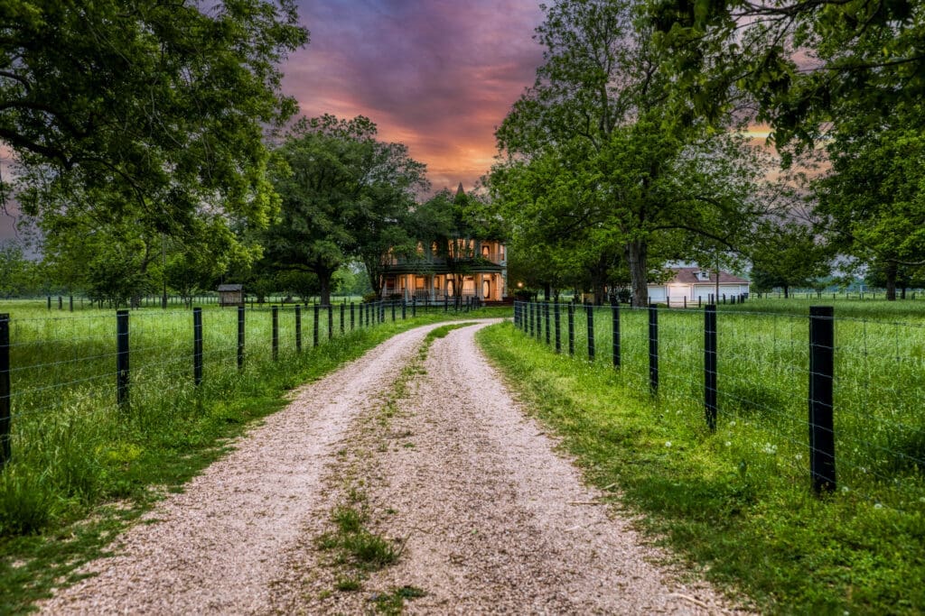 The Able Acres Farm and Ranch home sits amid grand pecan trees and vintage oak trees. (Photo by Jams Pharoan)