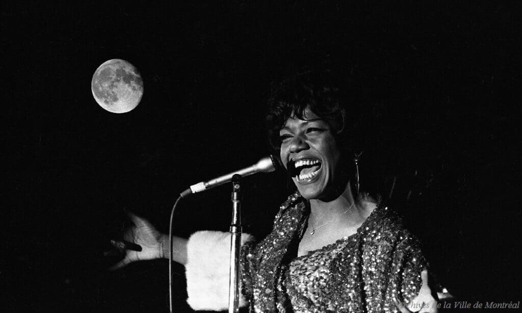 Jewel Brown performs with Louis Armstrong at the Palace of Nations in Geneva, Switzerland, 1968. (Photo by Gordon Beck)