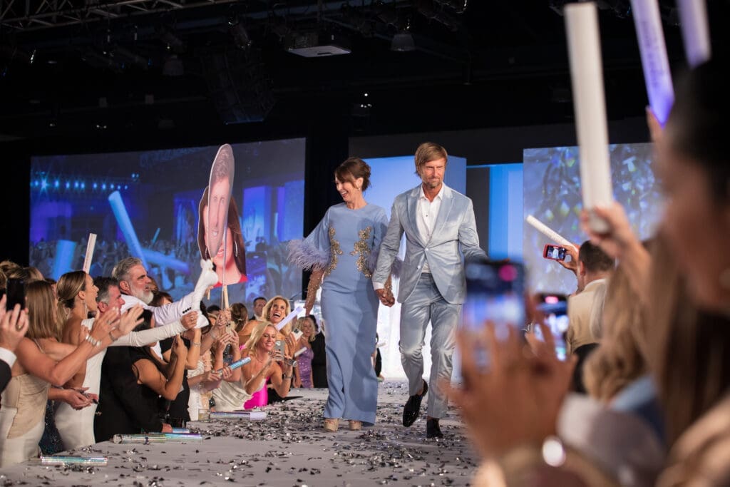 Community Champions Julie and Scott Lile hit the runway at Interfaith's The Walk gala. (Photo courtesy of Daniela Weaver)