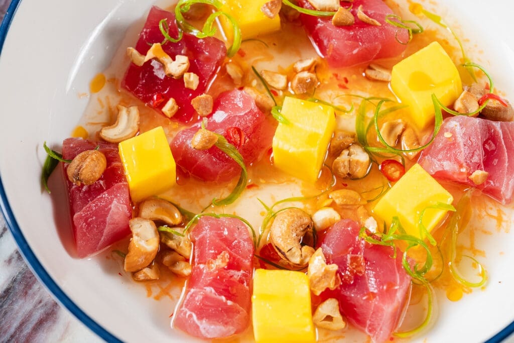 The Even Coast raw menu features big eye tuna crudo, yellowtail crudo, and oysters. (Photo by Jasonbyg Photography)