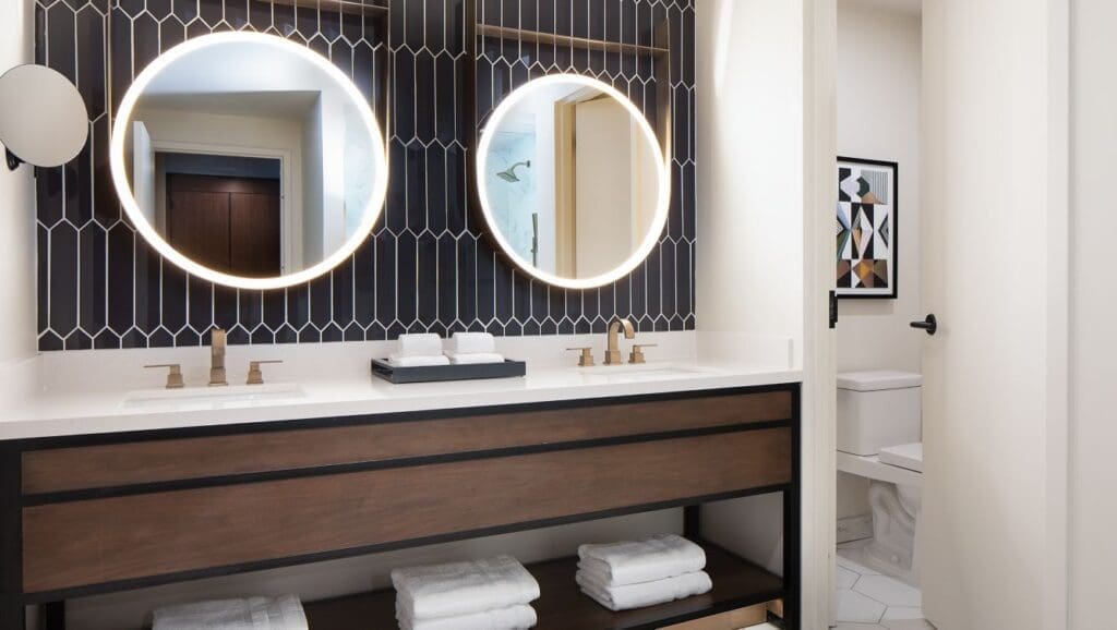 Geometric nods repeat in the junior suite bathroom.