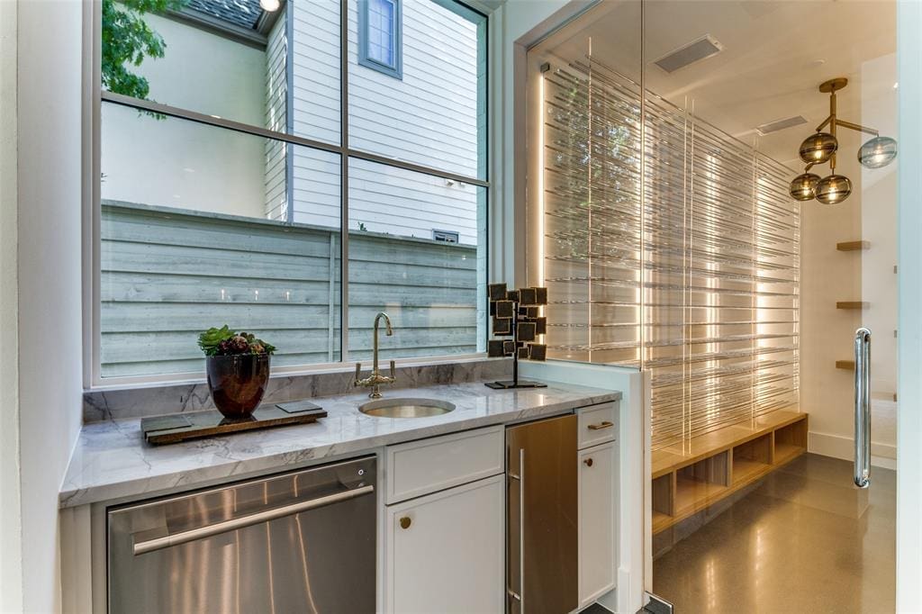 A wet bar and temperature-controlled wine room.