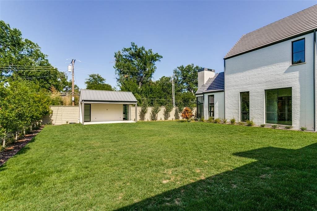 The manicured backyard features a 360-square-foot cabana. 