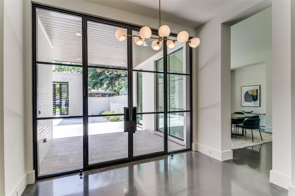 The glass-walled entryway in the modern Bluffview home. 