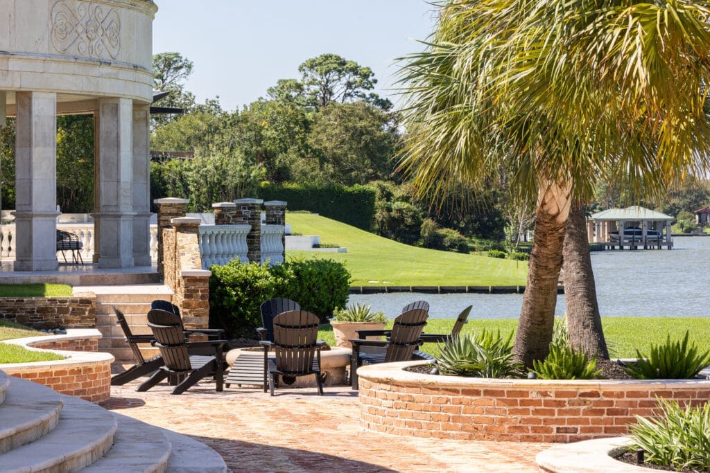 The fire pit and palm trees lend a resort like feel to 401 Lakeshore Drive in El Lago, Texas.  (Photo by Laurie Perez)